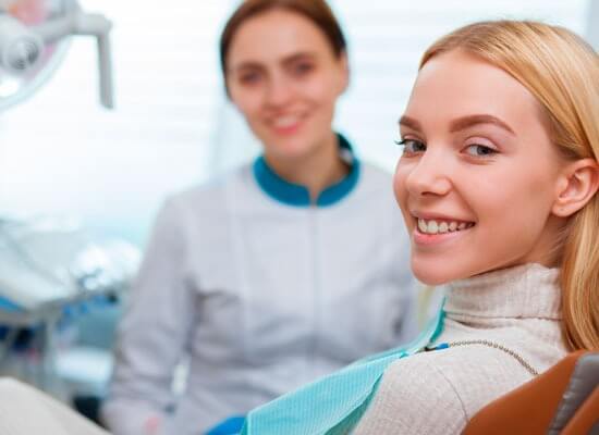 Smiling patient with dentist