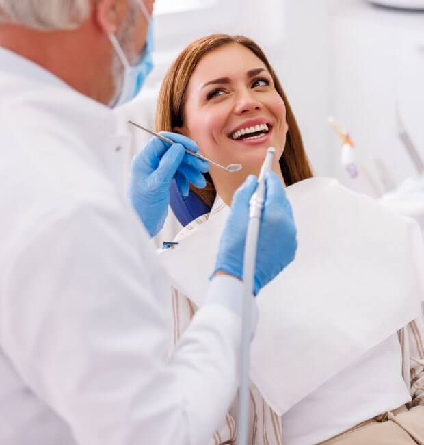 Dentist checking a patient's teeth