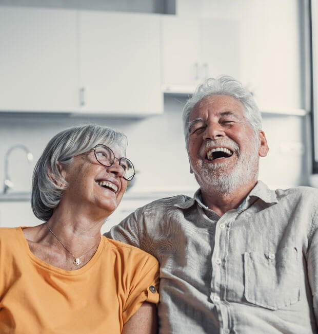 A happy smiling elderly couple with dentures