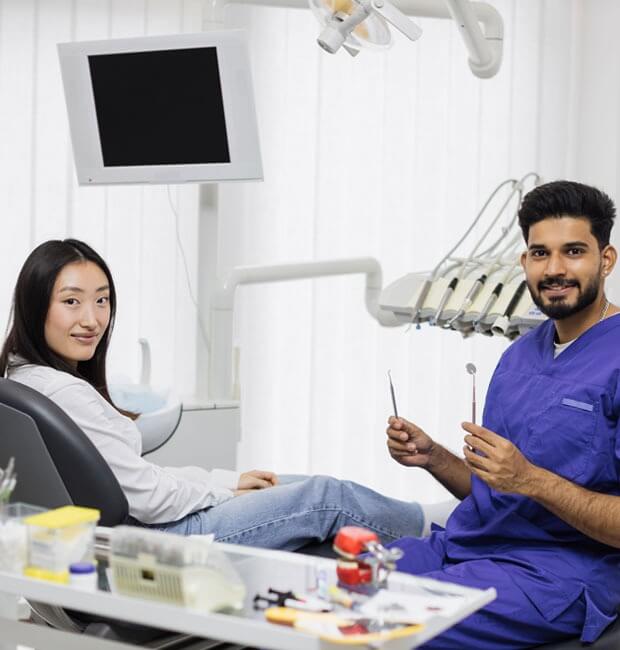 Dentist preparing to do a teeth cleaning on a patient