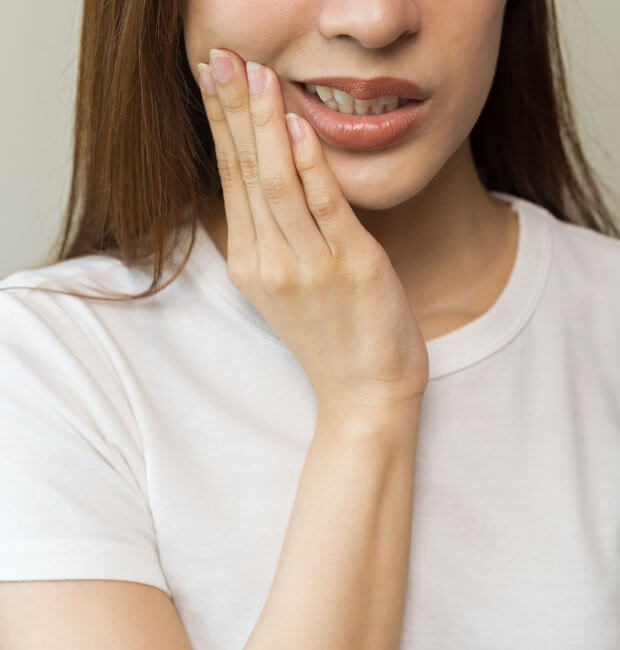 A female patient having teeth sensitivity problems